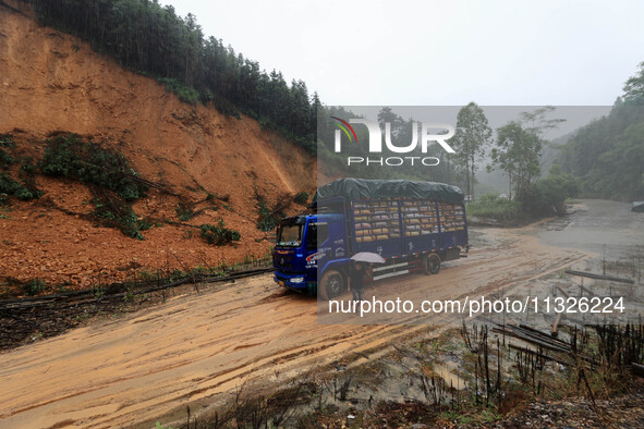 A slope is collapsing at the Sanmatun road section in Liuzhou City, Guangxi Province, China, on June 13, 2024. 