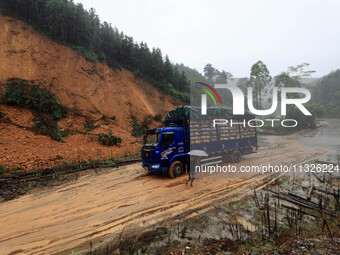 A slope is collapsing at the Sanmatun road section in Liuzhou City, Guangxi Province, China, on June 13, 2024. (