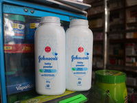 Bottles of Johnson & Johnson baby powder are being displayed at a drugstore in Srinagar, India, on June 13, 2024. Johnson & Johnson is agree...