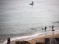 Palestinian fishermen are sailing on a boat in Deir el-Balah, in the central Gaza Strip, on June 13, 2024, amid the ongoing conflict in the...