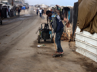 United Nations Agency for Palestinian Refugees (UNRWA) workers are cleaning a street in Deir el-Balah, in the central Gaza Strip, on June 13...