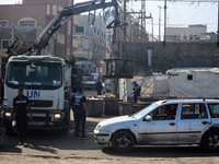 United Nations Agency for Palestinian Refugees (UNRWA) workers are cleaning a street in Deir el-Balah, in the central Gaza Strip, on June 13...