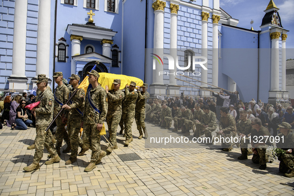 People are attending a funeral service for Captain Arsen Fedosenko, a photographer for the Media Center of the Ukrainian Armed Forces Strate...