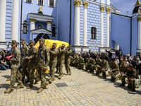 People are attending a funeral service for Captain Arsen Fedosenko, a photographer for the Media Center of the Ukrainian Armed Forces Strate...