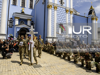 People are attending a funeral service for Captain Arsen Fedosenko, a photographer for the Media Center of the Ukrainian Armed Forces Strate...