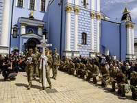 People are attending a funeral service for Captain Arsen Fedosenko, a photographer for the Media Center of the Ukrainian Armed Forces Strate...