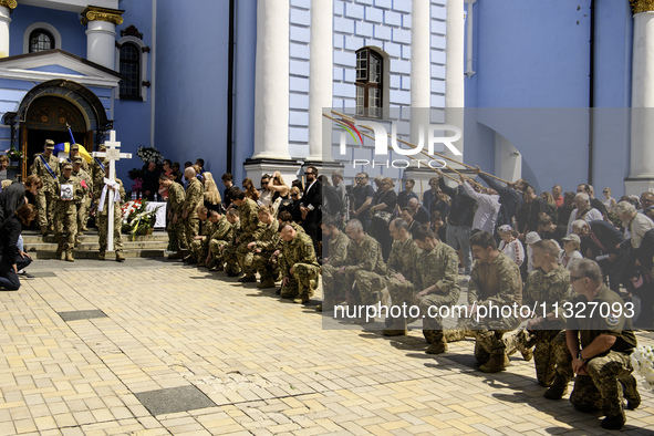 People are attending a funeral service for Captain Arsen Fedosenko, a photographer for the Media Center of the Ukrainian Armed Forces Strate...