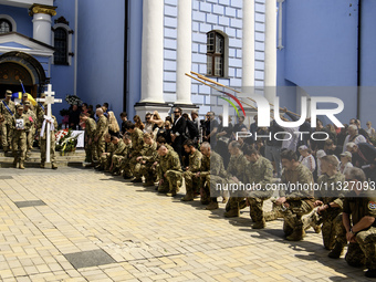 People are attending a funeral service for Captain Arsen Fedosenko, a photographer for the Media Center of the Ukrainian Armed Forces Strate...