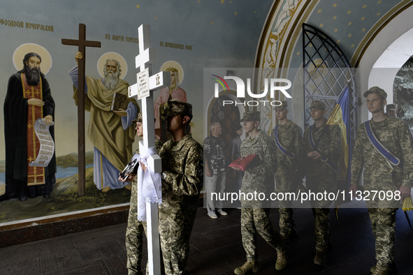 Servicemen are carrying the coffin of Captain Arsen Fedosenko, a photographer for the Media Center of the Ukrainian Armed Forces Strategic C...