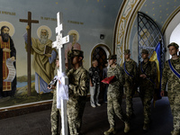 Servicemen are carrying the coffin of Captain Arsen Fedosenko, a photographer for the Media Center of the Ukrainian Armed Forces Strategic C...