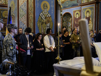 People are attending a funeral service for Captain Arsen Fedosenko, a photographer for the Media Center of the Ukrainian Armed Forces Strate...