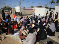 Palestinian women are reciting from memory the entire Koran, Islam's holy book, in one sitting at a camp for displaced people in Deir el-Bal...