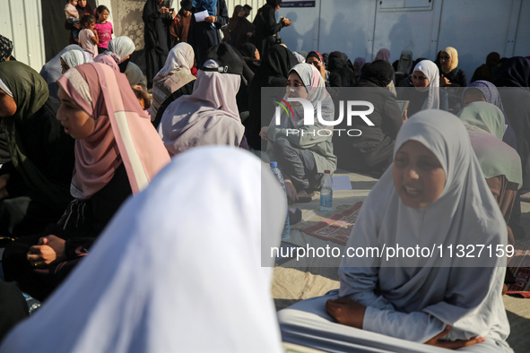 Palestinian women are reciting from memory the entire Koran, Islam's holy book, in one sitting at a camp for displaced people in Deir el-Bal...