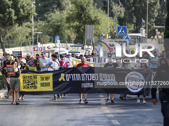 Students holding images of kidnapped Israelis rally, calling on the Israeli government to stop the war in Gaza and bring back the hostages,...