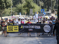 Students holding images of kidnapped Israelis rally, calling on the Israeli government to stop the war in Gaza and bring back the hostages,...