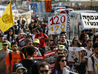 Students holding images of kidnapped Israelis rally, calling on the Israeli government to stop the war in Gaza and bring back the hostages,...