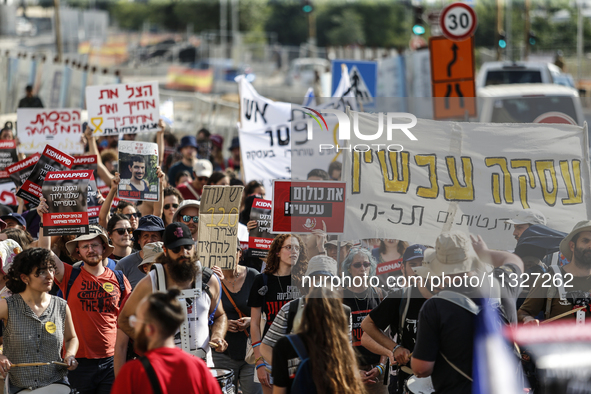 Students holding images of kidnapped Israelis rally, calling on the Israeli government to stop the war in Gaza and bring back the hostages,...