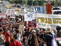 Students holding images of kidnapped Israelis rally, calling on the Israeli government to stop the war in Gaza and bring back the hostages,...