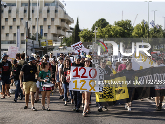 Students holding images of kidnapped Israelis rally, calling on the Israeli government to stop the war in Gaza and bring back the hostages,...