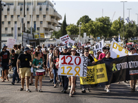 Students holding images of kidnapped Israelis rally, calling on the Israeli government to stop the war in Gaza and bring back the hostages,...