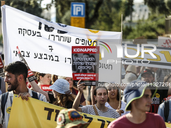 Students holding images of kidnapped Israelis rally, calling on the Israeli government to stop the war in Gaza and bring back the hostages,...