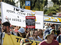 Students holding images of kidnapped Israelis rally, calling on the Israeli government to stop the war in Gaza and bring back the hostages,...