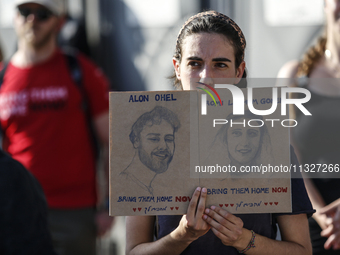 Students holding images of kidnapped Israelis rally, calling on the Israeli government to stop the war in Gaza and bring back the hostages,...