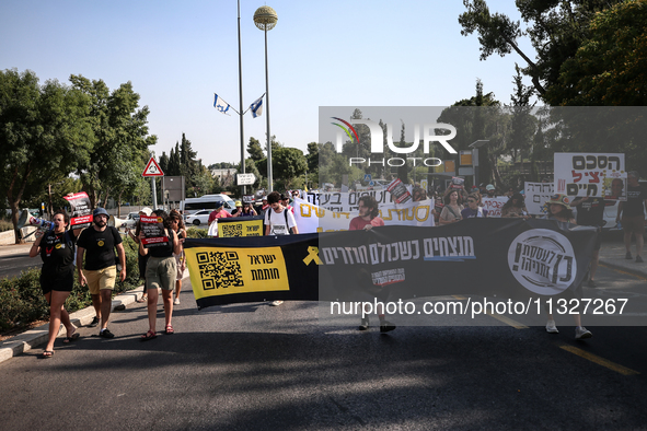 Students holding images of kidnapped Israelis rally, calling on the Israeli government to stop the war in Gaza and bring back the hostages,...