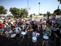 Students holding images of kidnapped Israelis rally, calling on the Israeli government to stop the war in Gaza and bring back the hostages,...