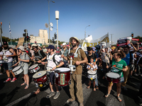 Students holding images of kidnapped Israelis rally, calling on the Israeli government to stop the war in Gaza and bring back the hostages,...