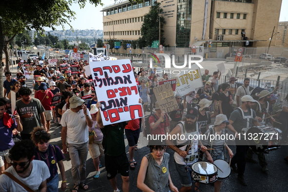 Students holding images of kidnapped Israelis rally, calling on the Israeli government to stop the war in Gaza and bring back the hostages,...