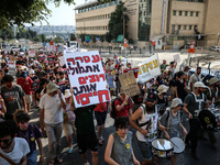 Students holding images of kidnapped Israelis rally, calling on the Israeli government to stop the war in Gaza and bring back the hostages,...