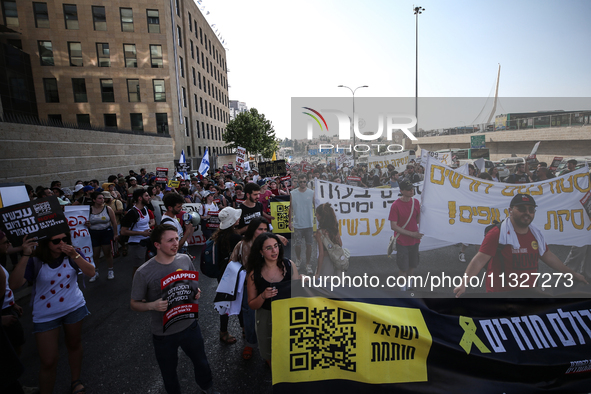 Students holding images of kidnapped Israelis rally, calling on the Israeli government to stop the war in Gaza and bring back the hostages,...