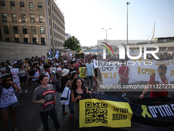 Students holding images of kidnapped Israelis rally, calling on the Israeli government to stop the war in Gaza and bring back the hostages,...