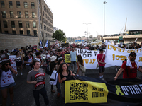 Students holding images of kidnapped Israelis rally, calling on the Israeli government to stop the war in Gaza and bring back the hostages,...