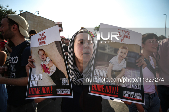 Students holding images of kidnapped Israelis rally, calling on the Israeli government to stop the war in Gaza and bring back the hostages,...