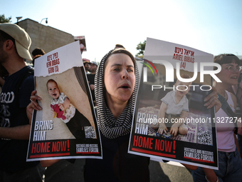 Students holding images of kidnapped Israelis rally, calling on the Israeli government to stop the war in Gaza and bring back the hostages,...