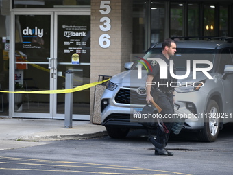 The Elmhurst Police are taking evidence out of US Bank. An armed bank robbery is occurring at US Bank in Elmhurst, Illinois, United States,...