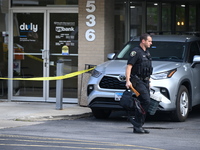 The Elmhurst Police are taking evidence out of US Bank. An armed bank robbery is occurring at US Bank in Elmhurst, Illinois, United States,...