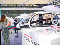 Visitors are visiting an electric vertical take-off and landing vehicle at The 10th China (Shanghai) International Technology Fair in Shangh...