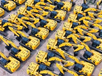 A batch of Chinese-made excavators is waiting to be loaded for export at Yantai Port in Yantai, China, on June 13, 2024. On June 7, 2024, da...