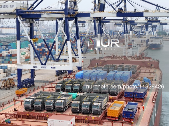 A batch of Chinese-made trucks is being loaded for export at Yantai Port in Shandong province, in Yantai, China, on June 13, 2024. Data rele...