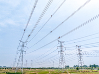 Power supply workers are carrying out acceptance work on a new 500-kilovolt transmission line in Nanjing, Jiangsu province, China, on June 1...