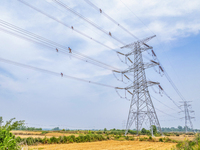 Power supply workers are carrying out acceptance work on a new 500-kilovolt transmission line in Nanjing, Jiangsu province, China, on June 1...