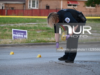 Over 29 evidence markers are being placed at the crime scene, highlighting where shell casings are being recovered by the Chicago police. A...