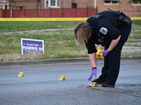 Over 29 evidence markers are being placed at the crime scene, highlighting where shell casings are being recovered by the Chicago police. A...