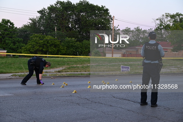 Over 29 evidence markers are being placed at the crime scene, highlighting where shell casings are being recovered by the Chicago police. A...