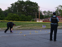 Over 29 evidence markers are being placed at the crime scene, highlighting where shell casings are being recovered by the Chicago police. A...