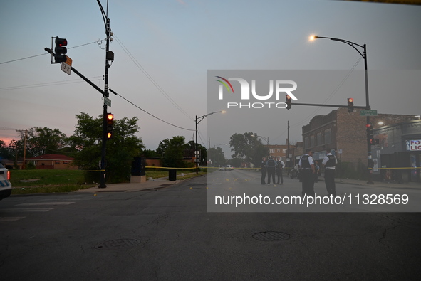 Over 29 evidence markers are being placed at the crime scene, highlighting where shell casings are being recovered by the Chicago police. A...