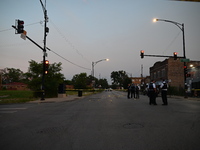 Over 29 evidence markers are being placed at the crime scene, highlighting where shell casings are being recovered by the Chicago police. A...